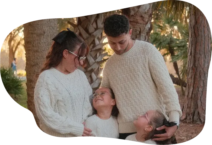 Flor and her family under the palms